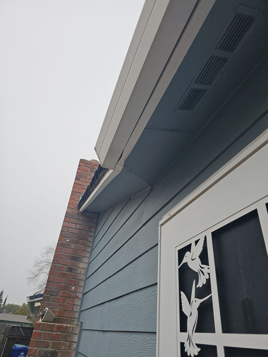 Hidden 2x6 dry rot exposed at the back-side soffit and fascia transition during Atwater roof tear-off