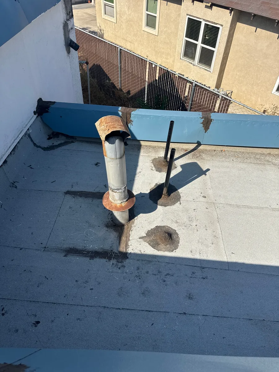 Before: worn flat roof before recoating