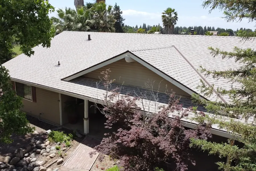 Completed asphalt shingle re-roof on a Ceres home