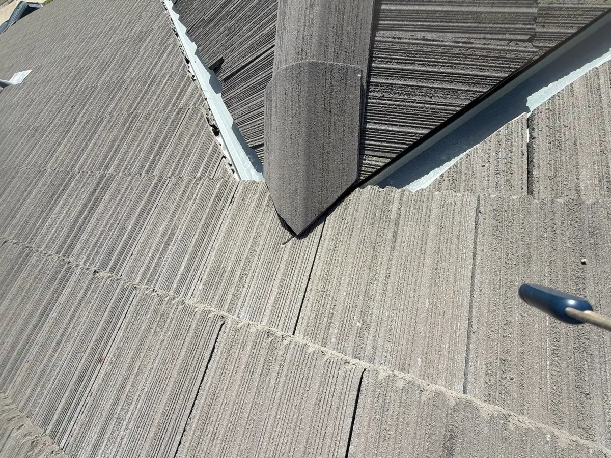 Gustine tile roof before repair — cracked, displaced roof tiles