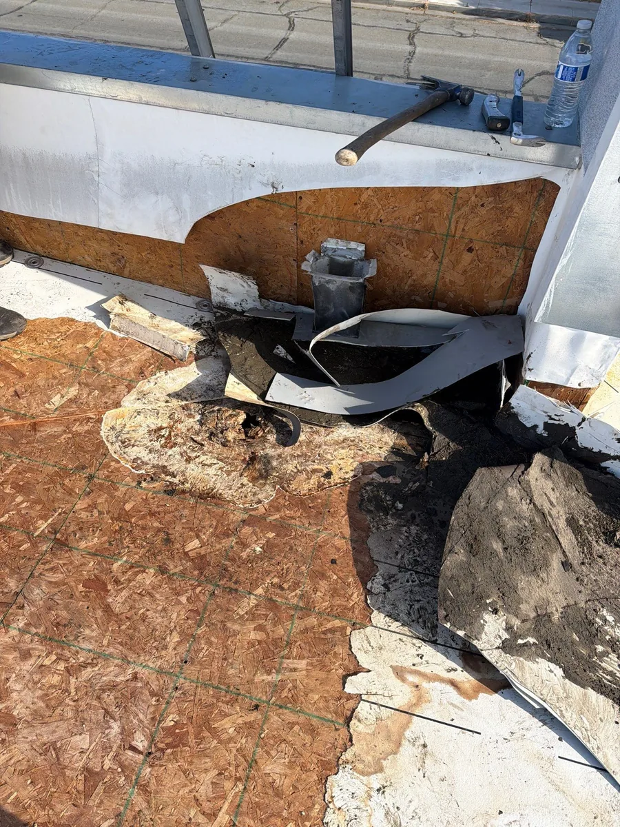 Merced commercial flat roof before coating — weathered membrane with ponding water