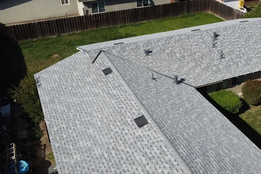 Aerial view of a completed asphalt shingle re-roof on a Modesto home