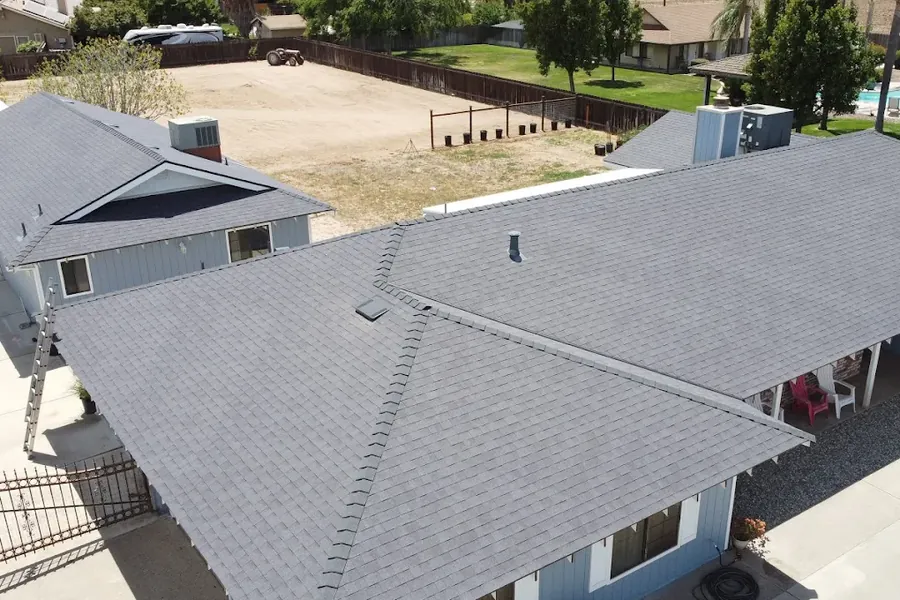 Aerial view of a completed asphalt shingle re-roof across a multi-building Riverbank property