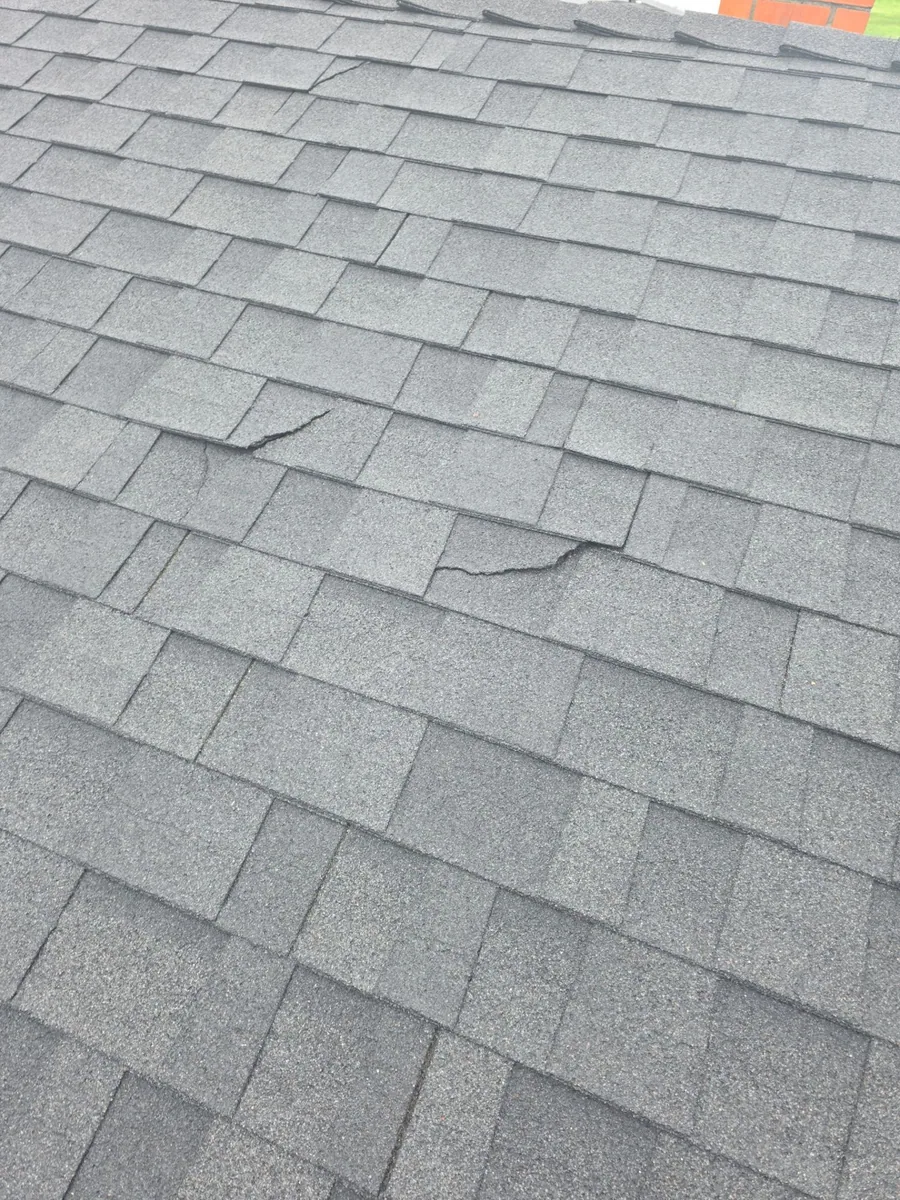 Cracked, nail-popped shingles on Charles Pl, Turlock, before tear-off